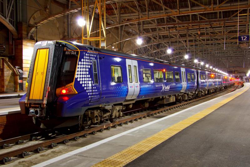 Photo of 380014 under the night lights at Glasgow Central