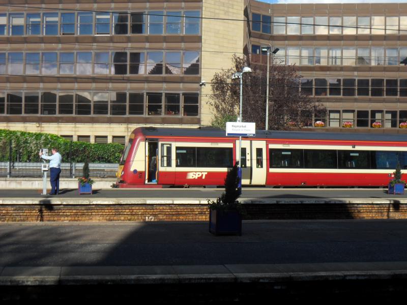 JT's chariot...: JT calls the signaller as he prepares to take Class 170 style SPT original livery on one last spin to Glasgow Works. Seen at Haymarket Platform 0 on 16th October 2011 Photo of JT's chariot...