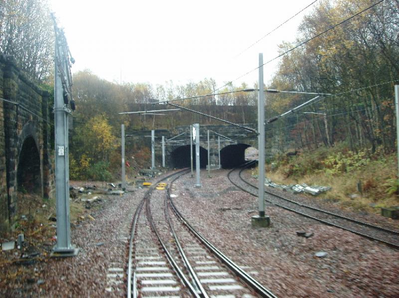 burma18.jpg: Approaching Terminus Jn and the Clydesdale Tunnels, with new electrification mast erected and being readied for the wires. Photo of burma18.jpg