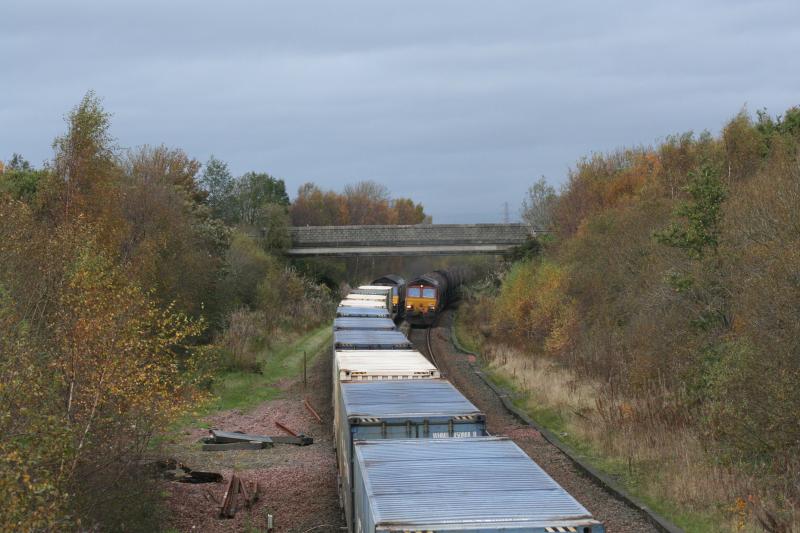 66432/66100: 66432 (4A13) passing 66100 (6D84)delayed Aberdeen-Mossend freight at Plean Jct. 30.10.11 Photo of 66432/66100