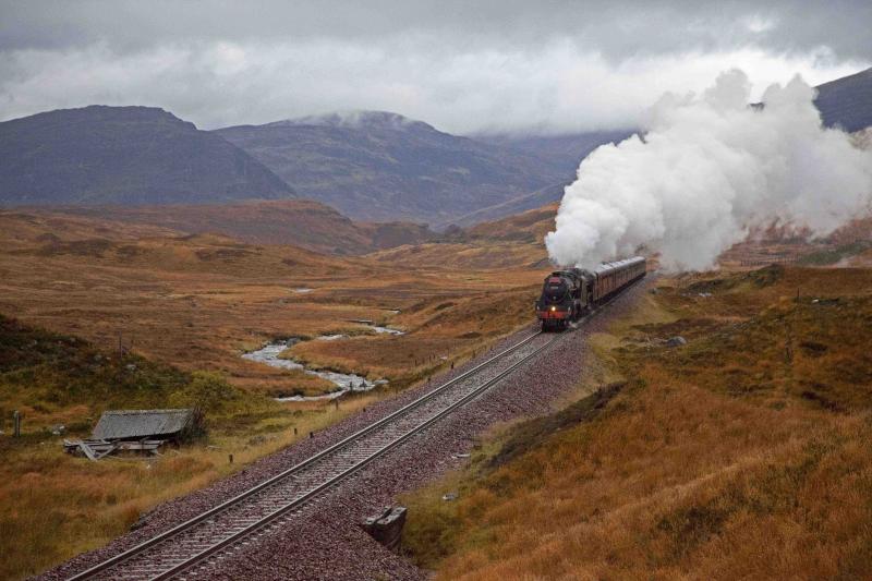 Climb to Corrour: 45407 piloting 44871 with the ECS from the Jacobite and two support coaches (load 9), banked by West Coast class 37 no. 37 516 on Monday 31 October 2011. Photographed north of Corrour on the uphill gradient. Photo of Climb to Corrour
