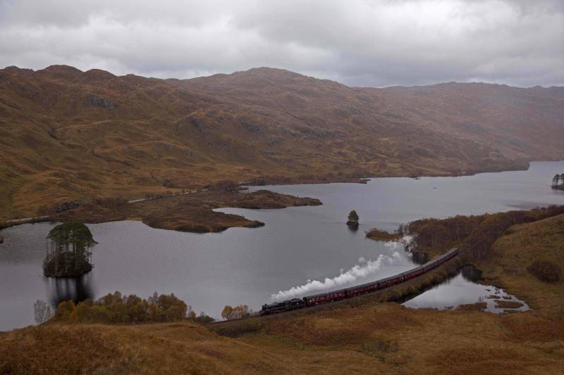 Final Jacobite of 2011: The final Jacobite of 2011 passes the causeway at the western end of Loch Eilt on Friday 28 October, headed by 45407 and still running to 7 coaches. Rain was blowing in up the valley .. Photo of Final Jacobite of 2011