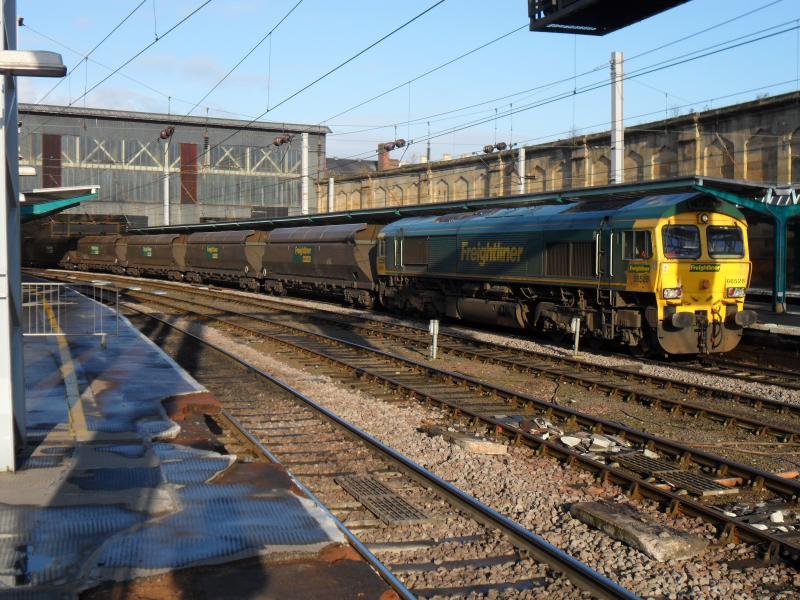 66528 at Carlisle: 66528 sits in Carlisle during a crew changeover with a loaded coal service to Drax Power Station. 12/11/11. Photo of 66528 at Carlisle