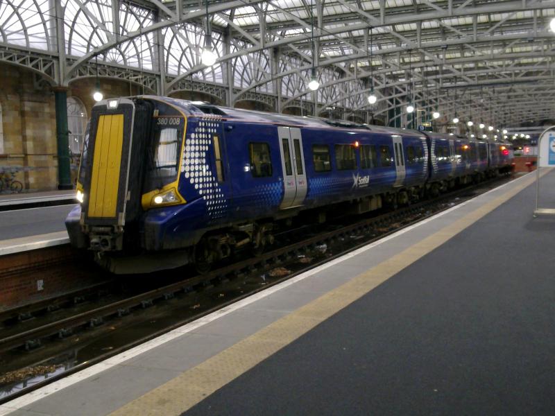 380008: With the weather of the day being appalling. The only service that seemed to be running to Ayrshire on Tuesday 29th November was the Glasgow - Ayr.
Here 380008 waits departure with then 1200 service from Glasgow Central to Ayr. Photo of 380008