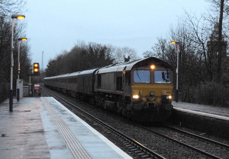66112 on 5Z66: 66112, 5Z66, Passes Pollokshaws West station Tue 29/11/2011 on craigintinney- Wabtec Kilmarnock with a set of CX coaches for refurbishment Photo of 66112 on 5Z66