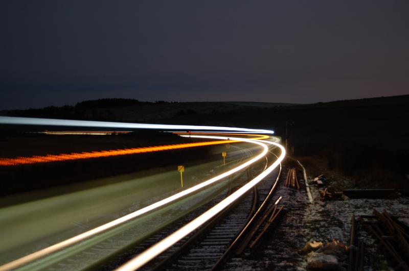 1A97 170420: with the clock showing 23:39, 170420 rounds the corner past Carmont under clear skies & with a small layer of snow on the ground illuminating the area. 7\12\2011 Photo of 1A97 170420