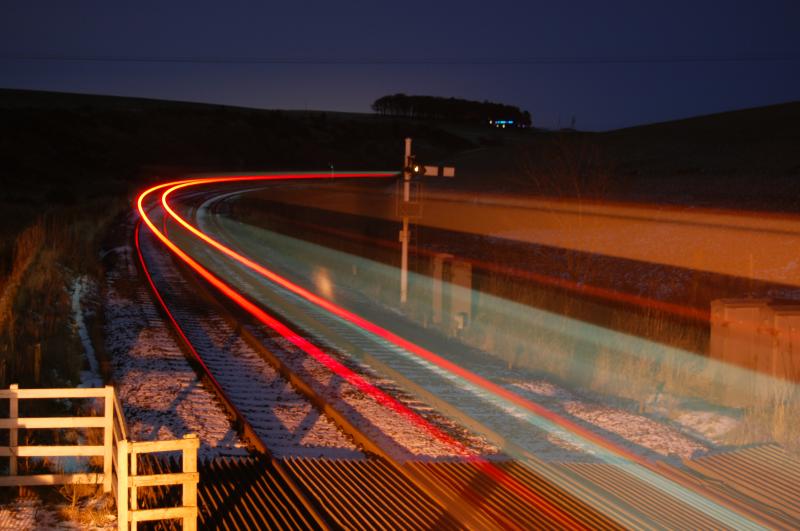 170401 1A95: The last train of the day hurrries past Carmont and on towards Stonehaven & Aberdeen. Running 2 minutes early at 23:59, 170401 is lit up by the moonlight & boxlights as it passes. 7\12\2011 Photo of 170401 1A95