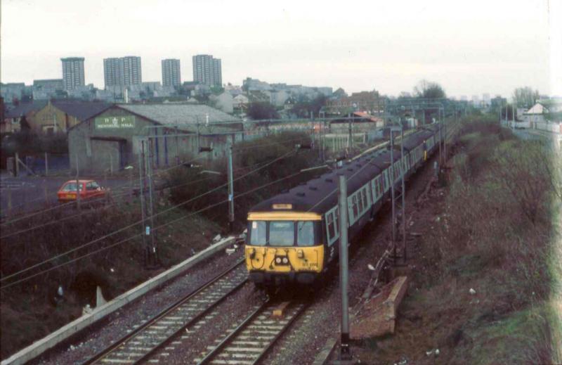 311s at Dalmuir: 099 and friend at Dalmuir in March 1990 on an Airdrie to Balloch run. Photo of 311s at Dalmuir