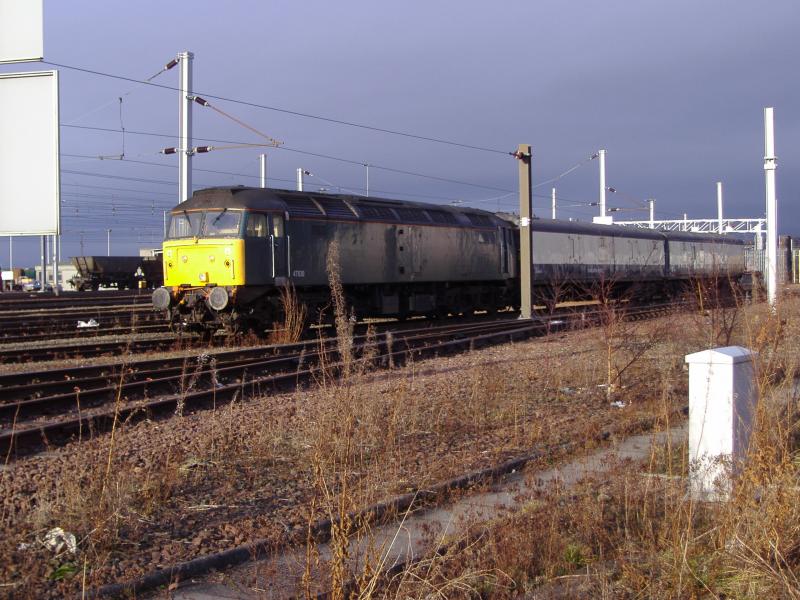 47830 at Mossend Yard: 47830 at Mossend Yard with two Translator/Barrier coaches. (18.12.05) Photo of 47830 at Mossend Yard