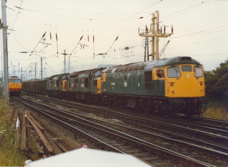 26005 pilots out of Mossend Yard: 26005 pilots two Class 37s on a Ravenscraig Iron Ore train at Mossend Yard. Photo of 26005 pilots out of Mossend Yard