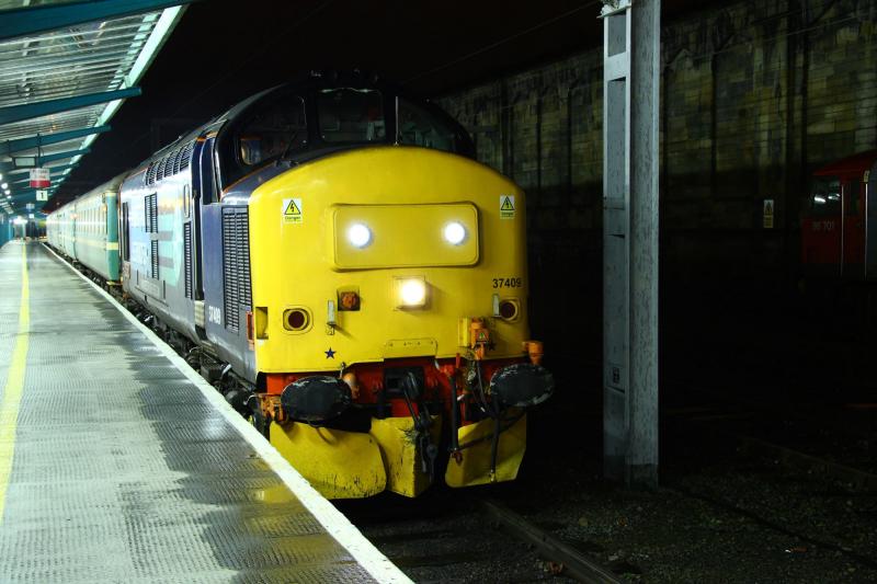 37409: 37409 with 2t21 Sellafield-Carlisle workers/passenger service having just arrived 6 mins early at Carlisle.19/01/2012 Photo of 37409