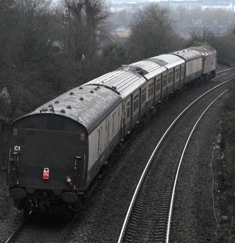 318270 Roof Damage: 318270 being dragged by 57304 on 5Z70, Sheilds Depot to Kilmarnock, approaching Busby Junction.
The damage, sorry not too clear, is to the roof and is above the drivers cab. Photo of 318270 Roof Damage