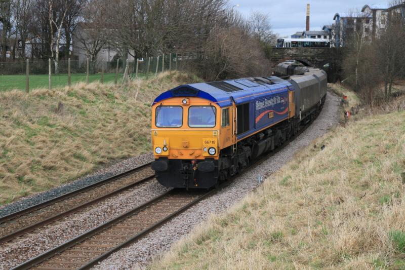 Metronet at Peffermill: 66719 on 4S81 01.12 Drax P Stn to Hunterston passing Peffermill playing fields on the Edinburgh Sub on 20-02-2012. At last something different. Thanks for advance timings. Photo of Metronet at Peffermill