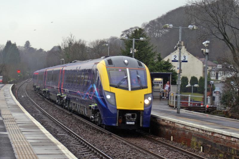 180103: 180103 passing through an early morning wet Barrhead on the 21st February working the 5Z56 0716 Wabtec Kilmarnock to Old Oak Common Ex Works move. Photo of 180103