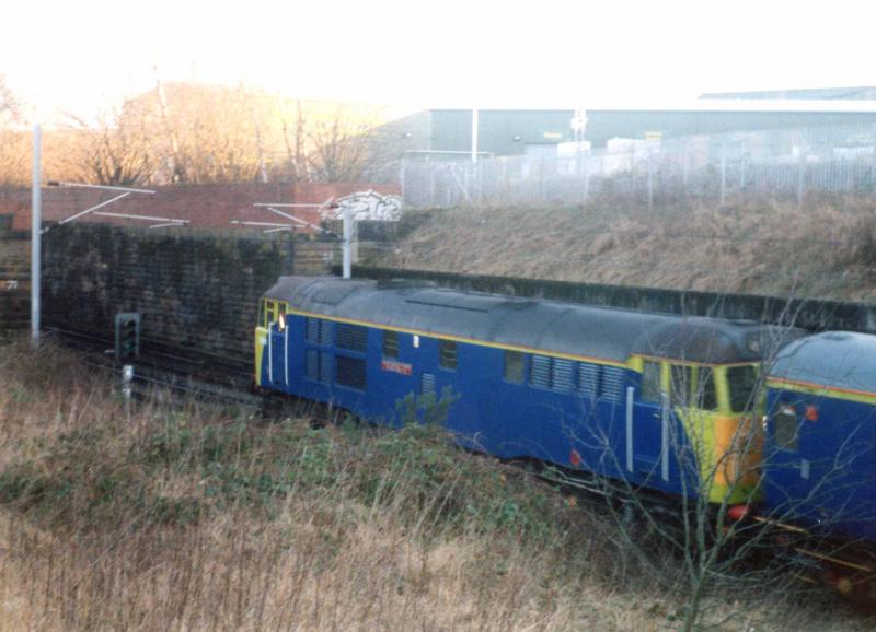 31 in Blue & Florescent Green 1: 31 ??? Pass under Pollokshaws Rd Overbridge just short of Larkfield Junction on a test train with another 31 on the rear with the same pukey livery Photo of 31 in Blue & Florescent Green 1