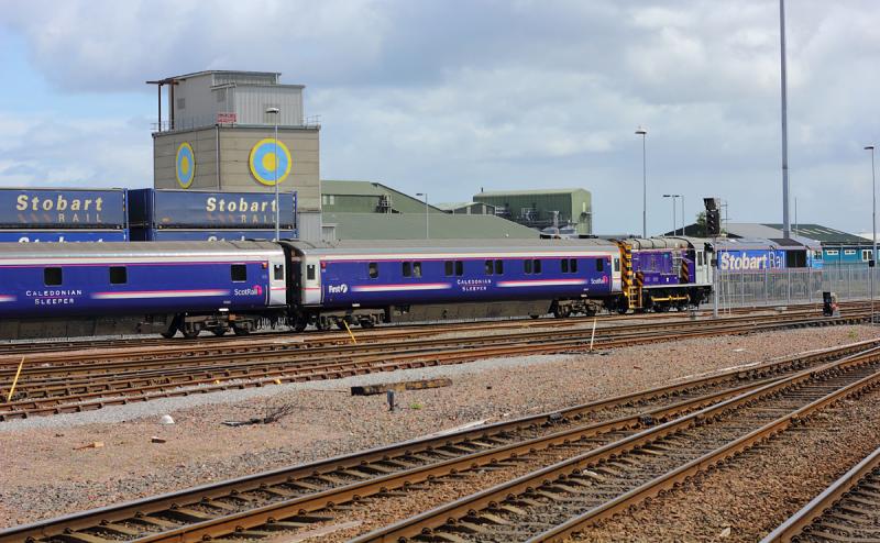 08308 Inverness: 08308 shunts some ScotRail sleeper coaches at Inverness on 28.05.11. 66414 can also be seen in the background. Photo of 08308 Inverness