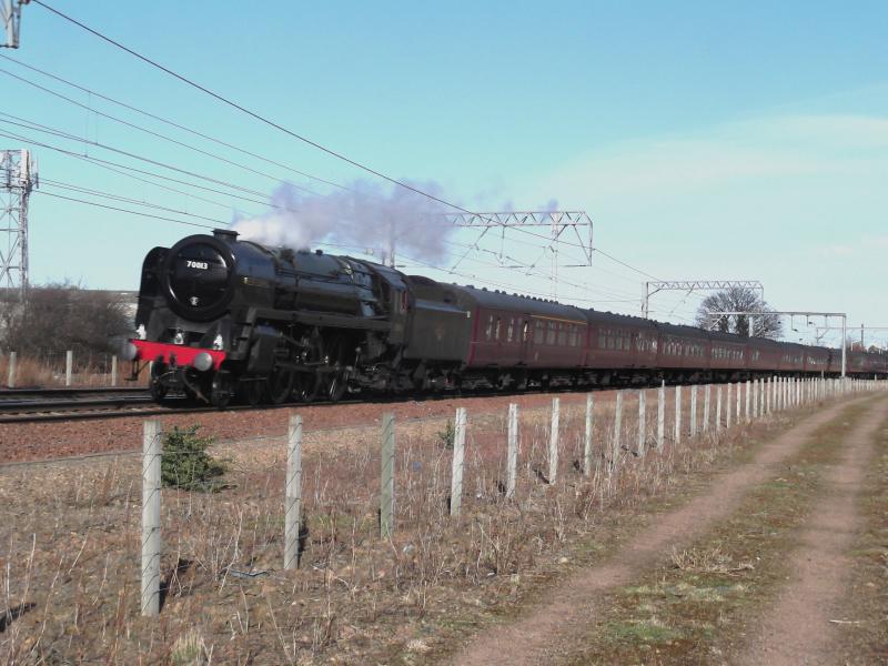 70013 thundering past Prestonpans: 'The Heart of Midlothian' 17-03-12
WCRC 47760 on rear. Photo of 70013 thundering past Prestonpans
