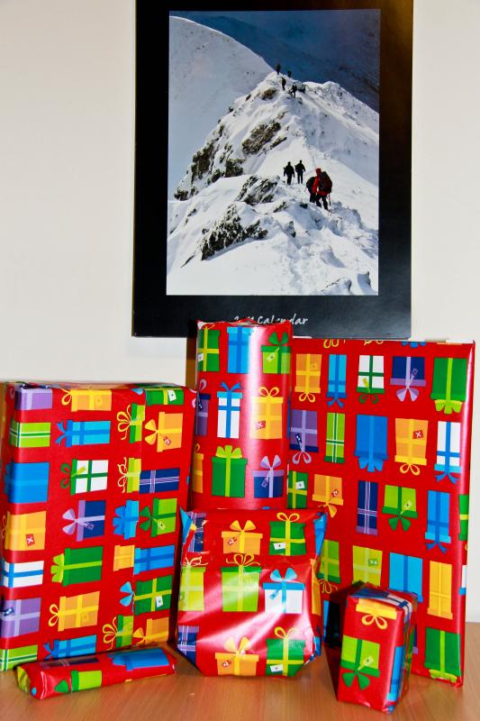 All of the presents..: Ewan's presents suitably wrapped to protect those who take offence taken whilst sitting below his home made 2012 Calendar. Photo of All of the presents..
