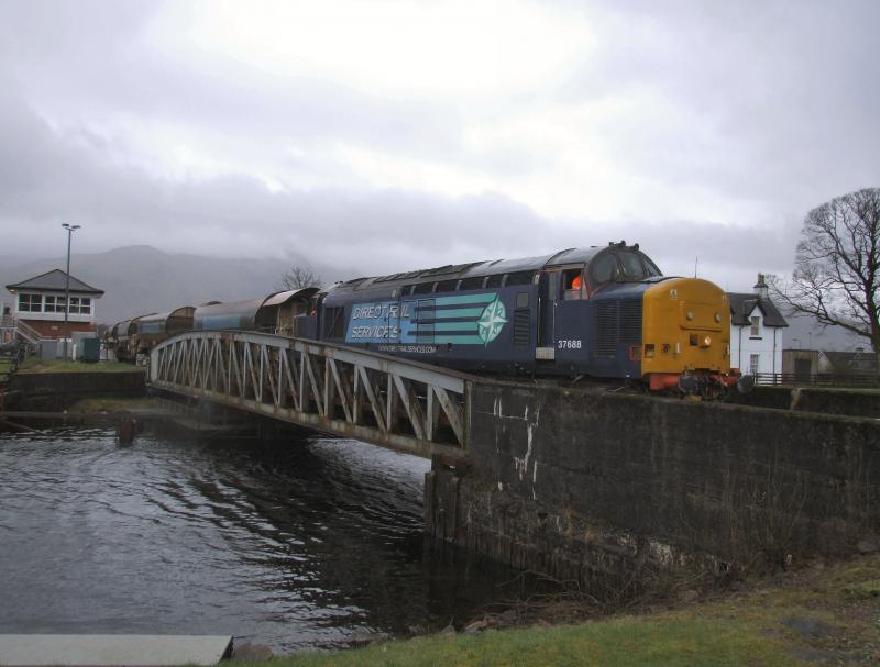 Photo of 37688 with 6K20 crosses Banavie Swingbridge.