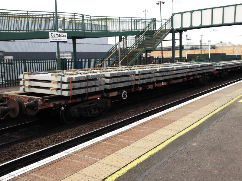 Salmon wagon with new concrete sleepers: Part of 6K05 Millerhill to Camelon seen waiting at Camelon station. Taken on 1st April 2012. One of the Salmon wagons with new concrete sleepers. Photo of Salmon wagon with new concrete sleepers