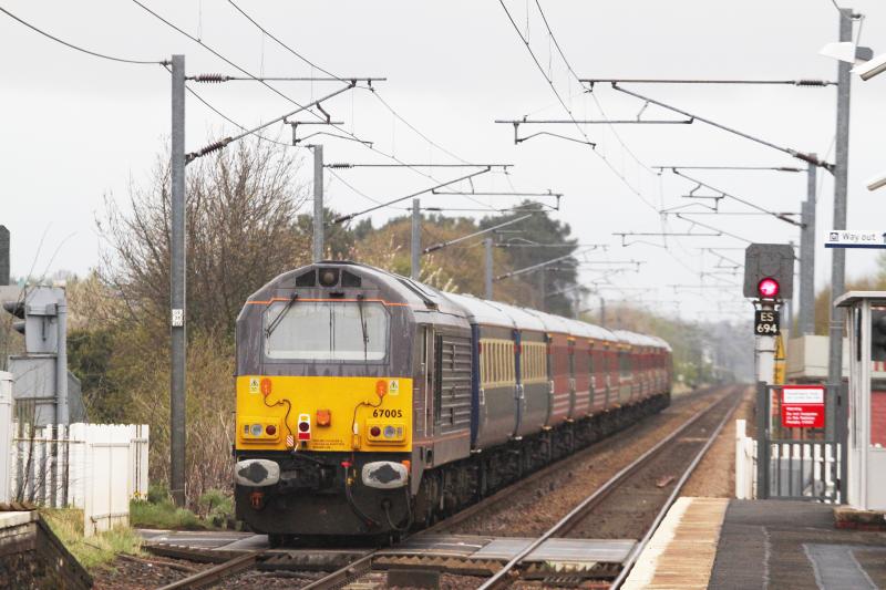 Royal Rump: 67005 brings up the rear of the Waverley Express as it passes over the level crossing at Cnoc an Righ on its way back to Shrewbury on 21 April 2012 Photo of Royal Rump
