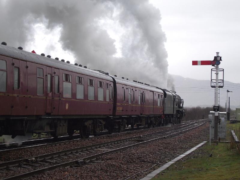 46115 departs Kingussie.: After a brief stop, 46115 'Scots Guardsman' blasts away
from Kingussie with 1Z42, the 10:51
Inverness - Glasgow Central leg of the
'Great Britain V' railtour. Photo of 46115 departs Kingussie.