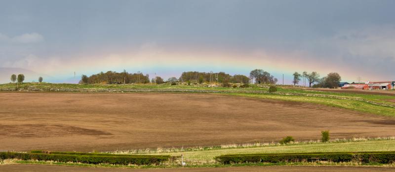 Rainbow over the wee county!: Whilst standing on the footbridge south of Plean the rain cleared to the East and produced this rather spectacular spectacle of a rainbow on the horizon. All a bit bizarre... Photo of Rainbow over the wee county!