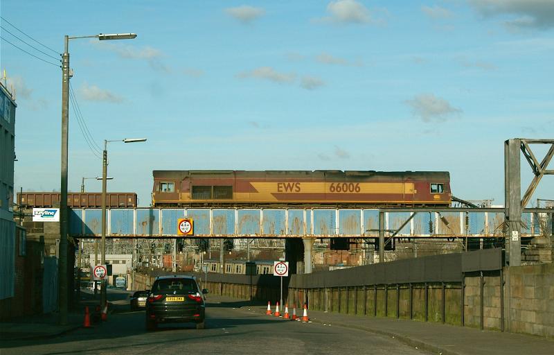 66 on top of a 314: 66006 on a Ayr to Millerhill Ballast passing over Salkeld St ( and a 314) on the City & Union line. 18th Feb 2007. Photo of 66 on top of a 314