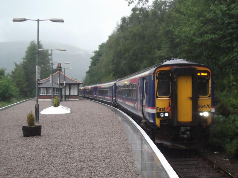Tyndrum Upper: A four-car 156 stands in the rain at Upper Tyndrum station with the evening train to Glasgow Queen Street - a day of torrential rain. This was two days before more rain caused a landslip and closure of the line. 26 June 2012 Photo of Tyndrum Upper