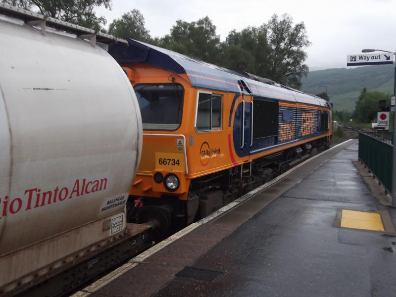 66734 pre-accident: 66734 pauses at Crianlarich with the 6S45 North Blyth-Fort William alumina tanks on 26 June 2012. Only two days later the same locomotive on the same train was derailed at Tulloch following a landslip. Photo of 66734 pre-accident