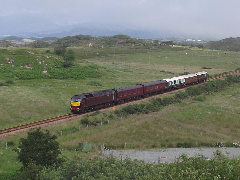 1Z57 at Drumbuie - 05 JULY 2012: 57001 passes Drumbuie with the 'Queen of Scots' stock, forming 1Z57, the 09:45 Keith - Kyle private charter. Photo of 1Z57 at Drumbuie - 05 JULY 2012
