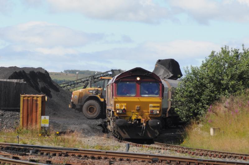 66030 Loading at New Cumnock: 66030 Waits to get loaded with coal at New cumnock wit coal by digger 9th Aug 2011 Photo of 66030 Loading at New Cumnock