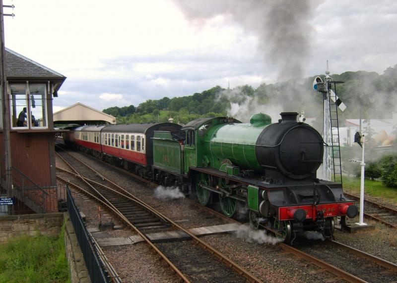 S.R.P.S.: No 246 Morayshire leaves Boness on the 12-15 to Manuel, 12th July,watched by the signalman. Photo of S.R.P.S.