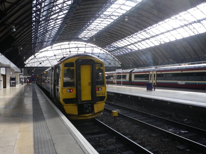 Underneath the Arches: August 2011, Glasgow Queen Street. A class 158 awaits its next duty on a warm summer afternoon. Photo of Underneath the Arches