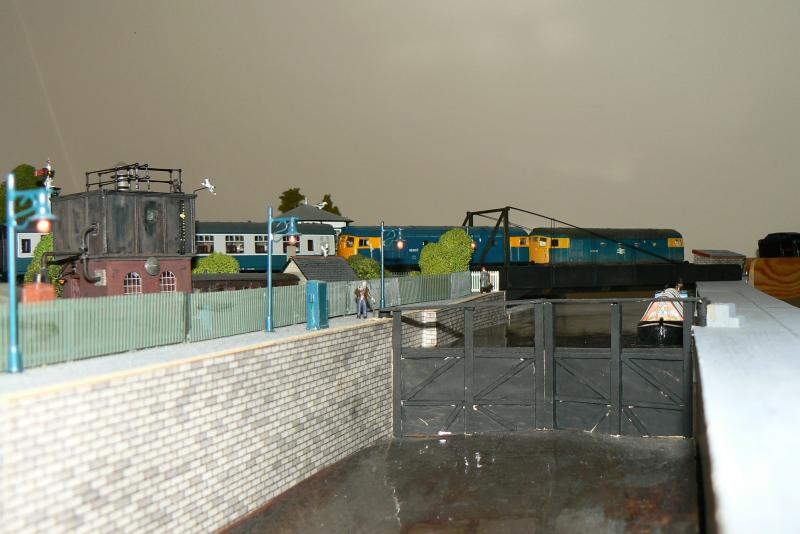 26.005 and 26.027 head north over swingbridge: Photo of 26.005 and 26.027 head north over swingbridge