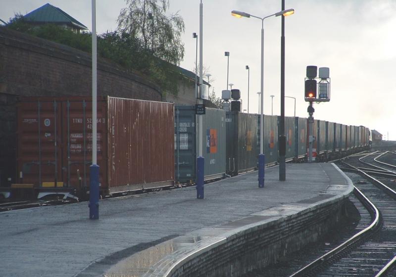 EWS Enterprise Juicy Containers:
Back in the days where EWS flowed my juices 66209 leads a lengthy container train out of Dundee Photo of EWS Enterprise Juicy Containers