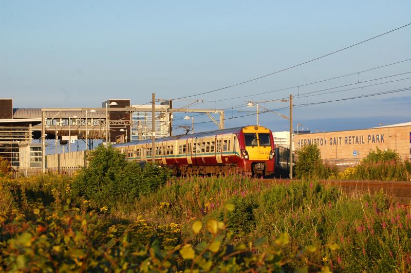 Edinburgh Park and Hermiston Gait: 334007 departs Edinburgh Park at 2000 to Helensburgh with the refurbished Hermiston Gait Retail Park behind. Friday 10th August 2012 Photo of Edinburgh Park and Hermiston Gait