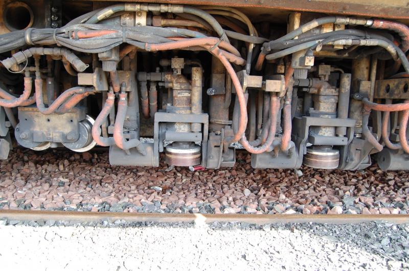 Close up of rail grinding units: The business end of the Railgrinder at Arbroath Photo of Close up of rail grinding units