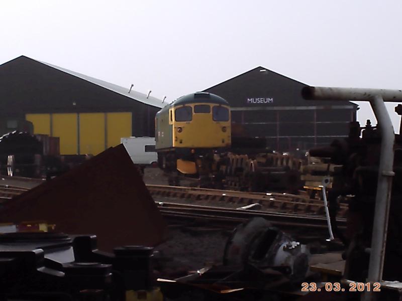 Scrap and 26024: 26024 sits surrounded by scrap metal in Bo'ness. Photo of Scrap and 26024