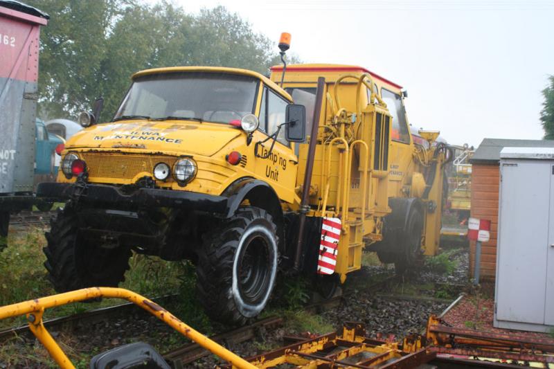 Track Tamping Unit: Unimog ro-rail track tamping vehicle at Brechin Steam Railway on a very wet soggy day 25 th Sept 2012 Photo of Track Tamping Unit