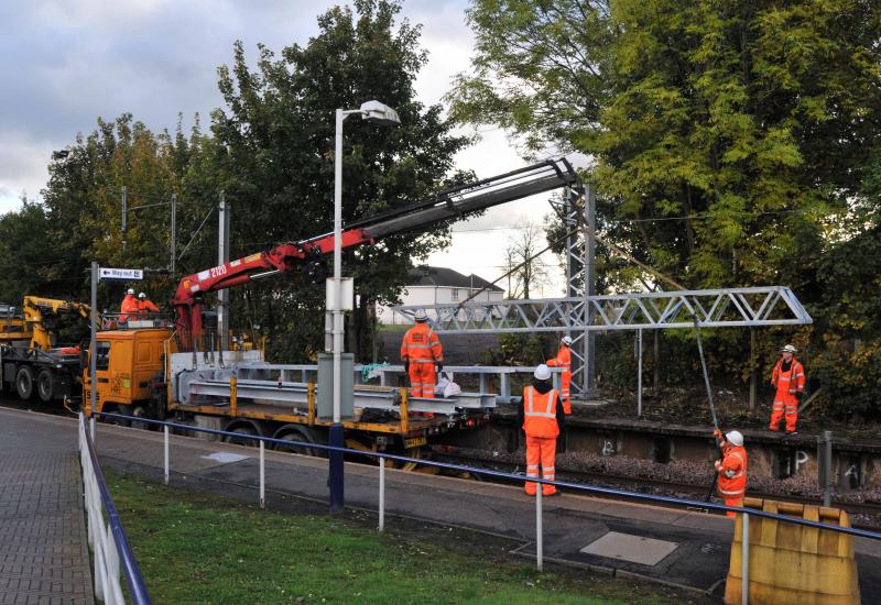 Corkerhill Station. Gantry Being raised: Sunday 14th oct 2012
Corkerhill Station
OHL Gantry Bein raised into Position in preparation of the line being Electrified Photo of Corkerhill Station. Gantry Being raised