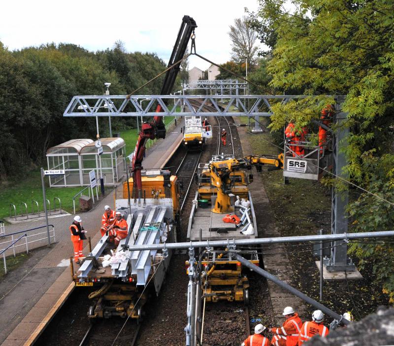 Corkerhill Station Gantry Final Fixing: Corkerhill Station
sun 14th Oct 2012
The New OHL gantry for the up coming electrifaction work is being finally secured Photo of Corkerhill Station Gantry Final Fixing
