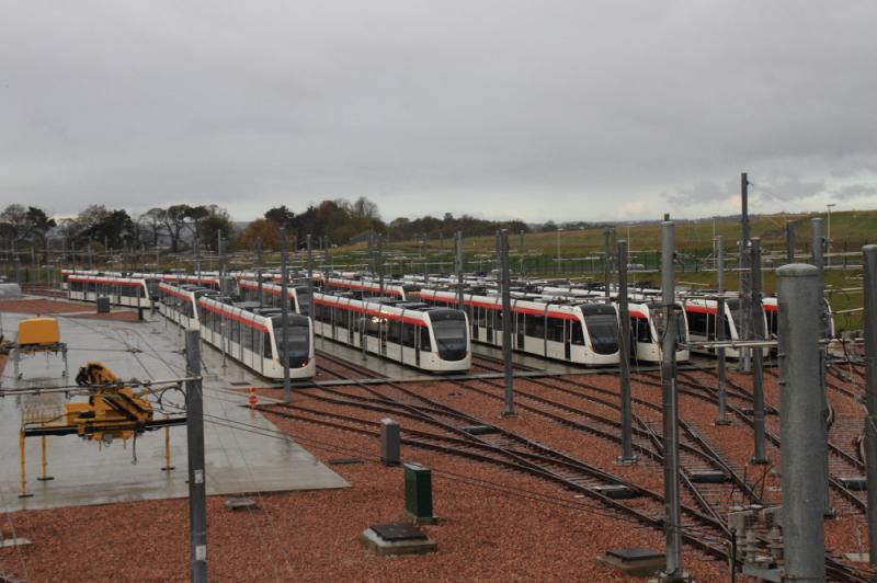18 Trams at Gogar: 18 Trams at rest outside the tram depot at Gogar on 02/.11/2012. Some trams had their lights on & pantographs up. Photo of 18 Trams at Gogar