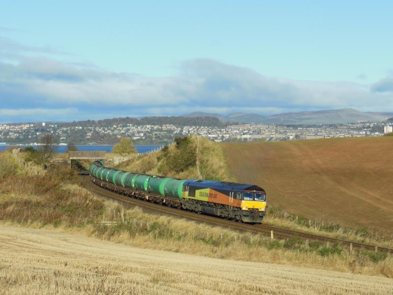 Linkswood Tanks pass Wormit:
With Dundee in the background 66850 rounds the bend at Wormit almost at it's destination with aviation fuel tanks for RAF Leuchars on a sunny autumn morning Photo of Linkswood Tanks pass Wormit