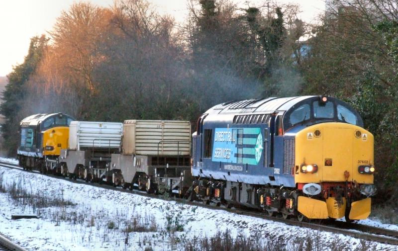 Photo of 37602/609 with 6S99 for George siding.