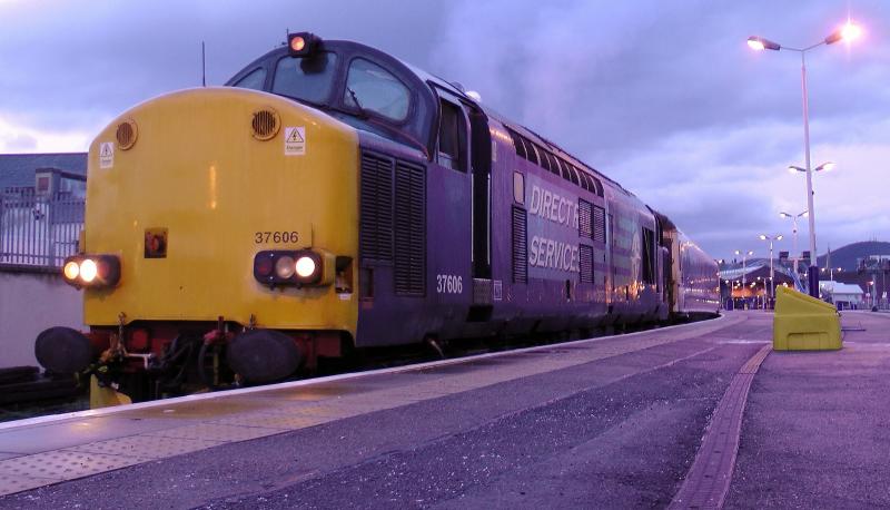 37606 Inverness 19/12/12:
37606 in Inverness platform 1 early morning of 19th December 2012 about to haul the empty sleeper stock to the depot in place of one of the 08's which were both out of service with wheel troubles Photo of 37606 Inverness 19/12/12