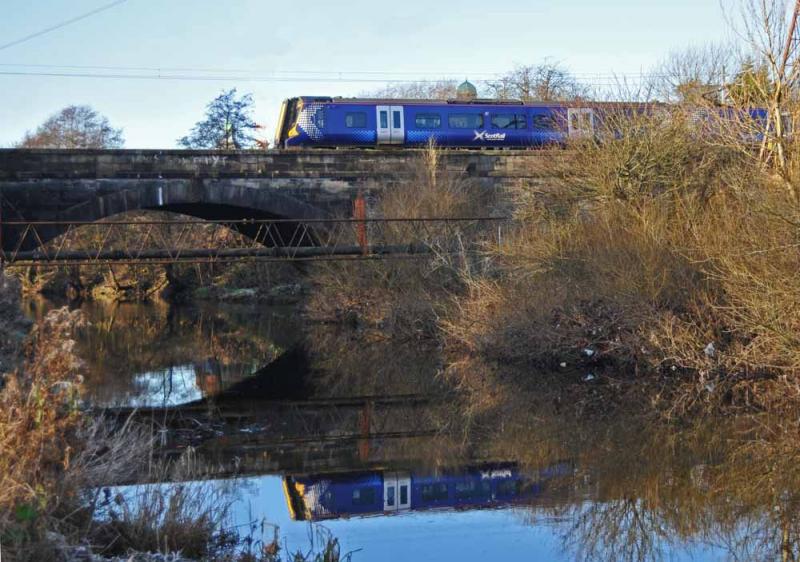 380006 On White Cart Bribge: 1st day of full electric service, 10th Dec 2012, 380006 crosses the White Cart Water Bridge. The Oldest active Rail Bridge in the WORLD Photo of 380006 On White Cart Bribge