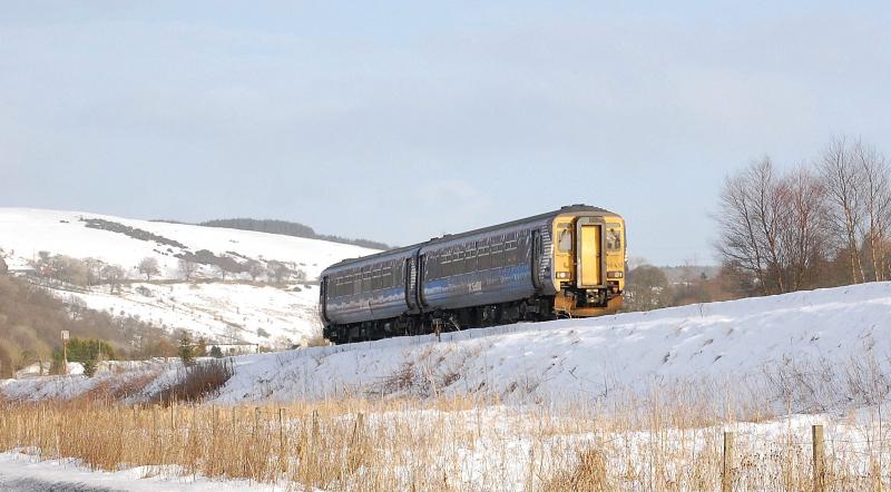 Sun snow and sprinter: 1A01 Glasgow to Kilmarnock passes Lugton's distant signal on 10th Jan 2010 Photo of Sun snow and sprinter