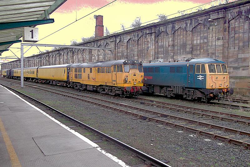 31190 at Carlisle: Network Rails Structure Gauging Train waits at Carlisle on Wednesday 31st January 2013, headed by 31190. In the background 86101 Sir William A Stanier FRS waits on the Network Rail Ice Breaker duties. Photo of 31190 at Carlisle