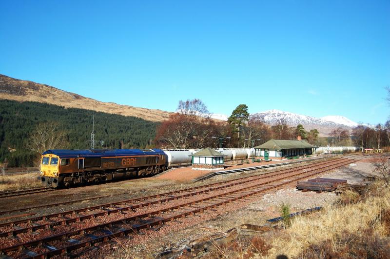 66733 Bridge of Orchy: 66733 awaits a Mallaig bound unit to pass before depating Bridge of Orchy with 6E45. 25/2/2013 Photo of 66733 Bridge of Orchy